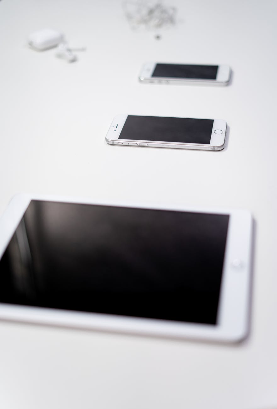 white ipad on white table
